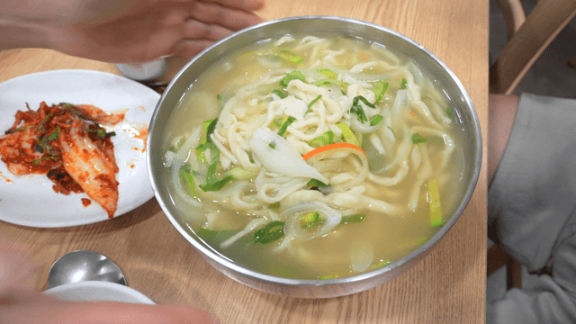 Hand-cut Korean noodles served with kimchi
