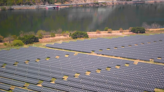 Solar panels near a calm lake