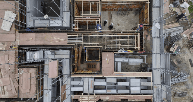 Construction site with workers and materials
