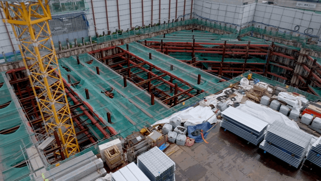 Construction site with cranes and materials