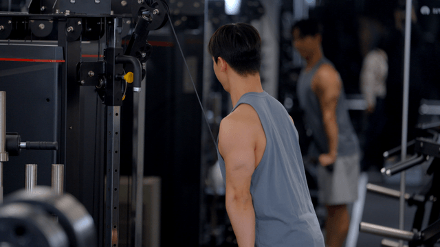 Man exercising in a gym with equipment