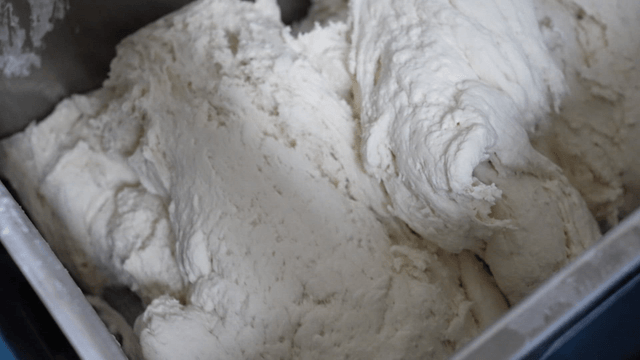 Dough being mixed in a large mixing machine