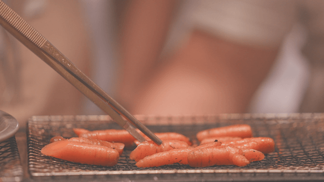 Carrots grilling on wire mesh