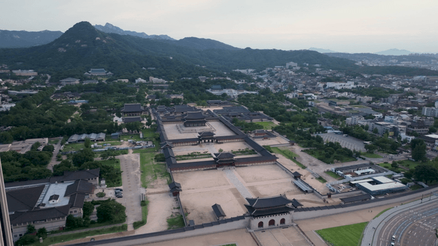 A historic palace surrounded by mountains