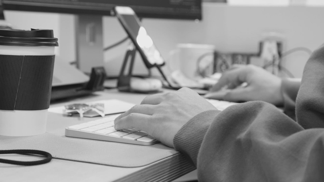 Office worker working with keyboard and mouse in office