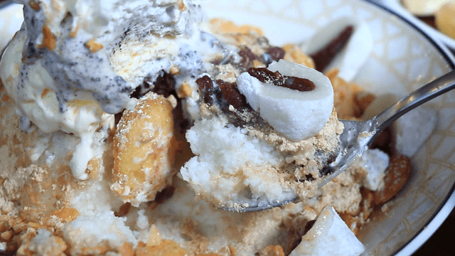 A spoonful of shaved ice with sweet rice cake with red bean filling