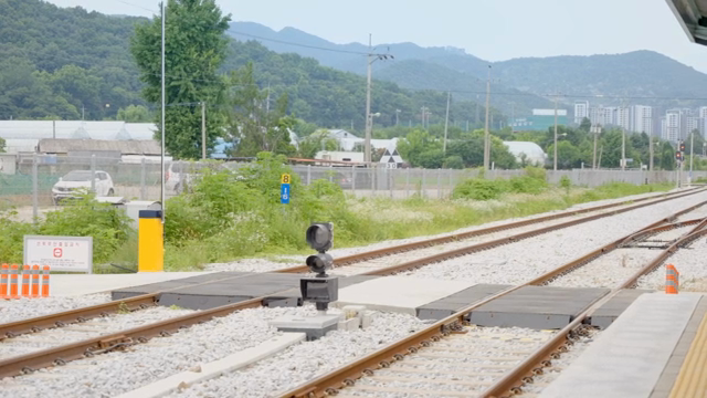 Railway tracks with mountains in the background