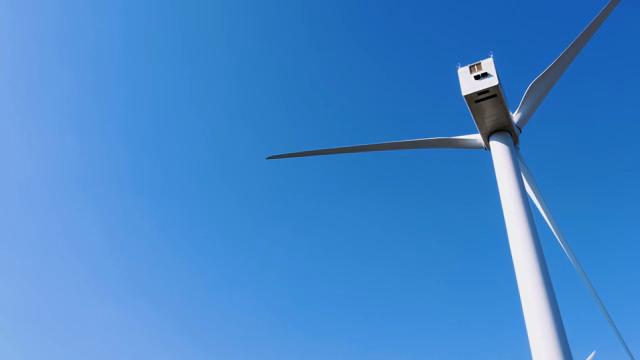 Wind turbine against a clear blue sky