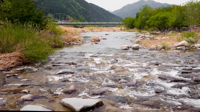 A tranquil river flowing through a valley