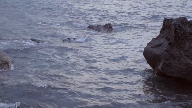 Rocky shoreline with gentle waves
