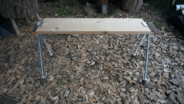 Handcrafted wooden bench placed on woodcraft pieces