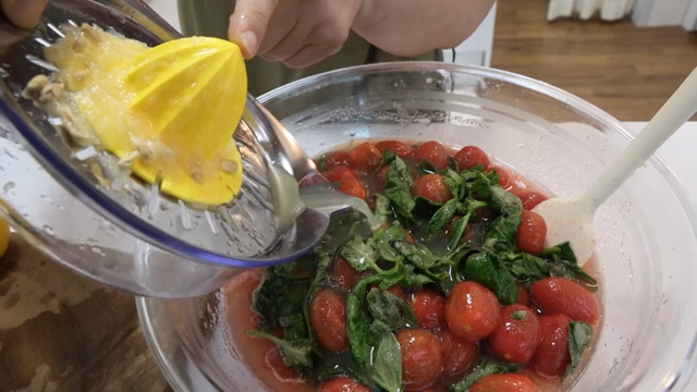 Lemon juice being squeezed over salad
