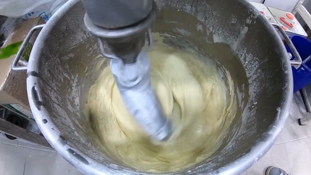 Dough being mixed in a large mixer