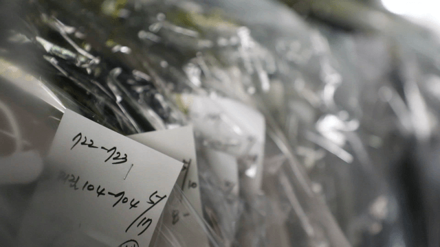 Plastic-wrapped clothes with labels