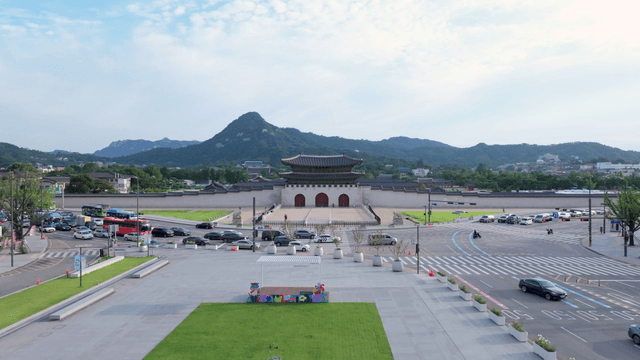 Gwanghwamun gate street with mountains in the background
