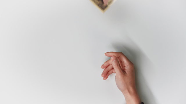 Hands exchanging Korean and Japanese currency