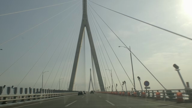 Cars driving on a large suspension bridge