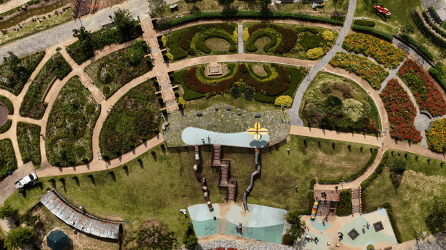 Park landscape with sculptural flowerbeds and walking paths