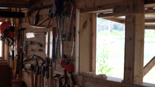 Workshop with various tools on the wall