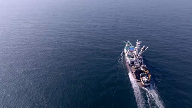 A ship sailing across the vast ocean