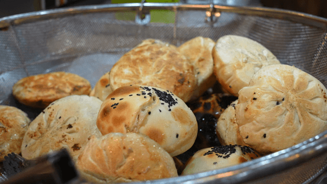 Freshly baked fire oven dumplings topped with sesame seeds