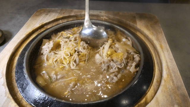 White ripened kimchi stew with bean sprouts and beef brisket