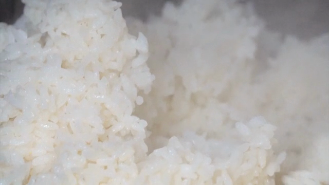 Steaming white rice being cooked