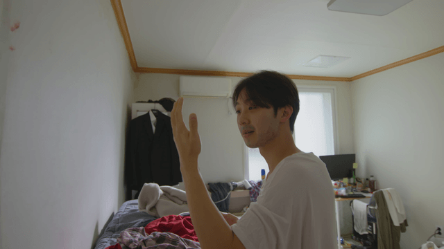 Man looking at his hand after catching a bug