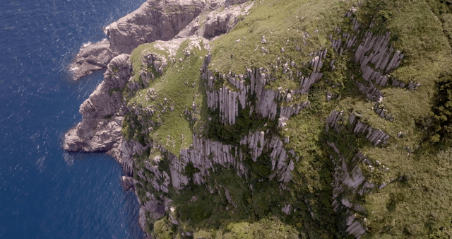 Coastal cliffs and lush green hills
