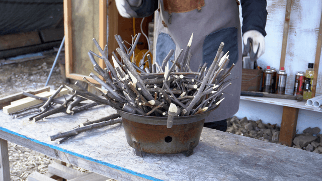 Carpenter filling container with chopped branches