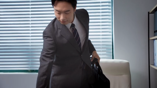 A businessman leaving the office after finishing work