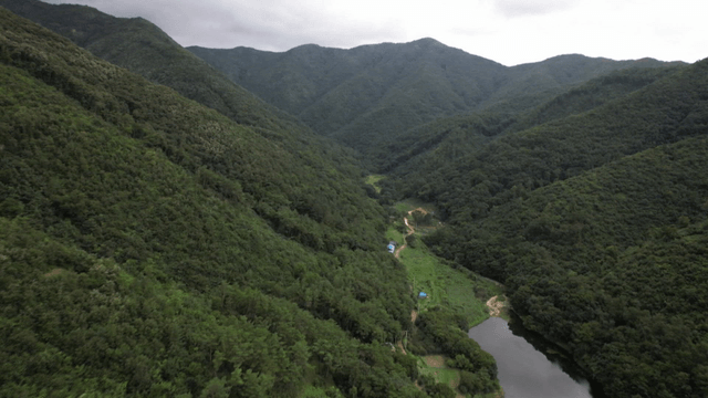 Green Mountain and Silent River with Small House