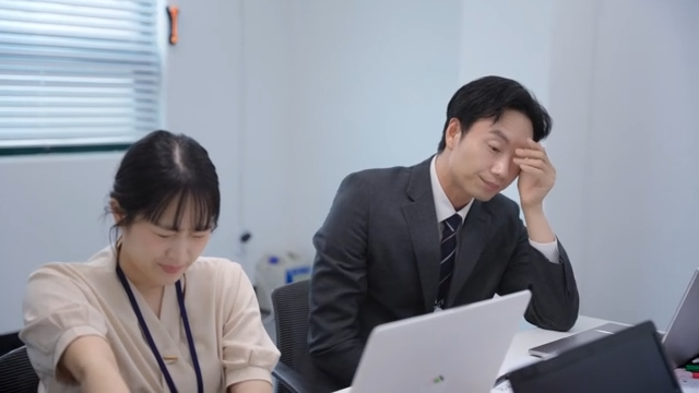 Tired office workers in a meeting room