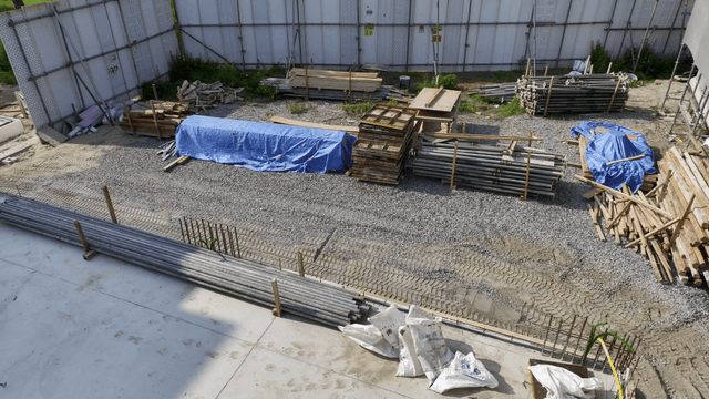 Construction site with materials and scaffolding