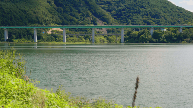 Bridge stretching across a quiet lake
