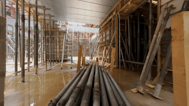 Construction site with scaffolding and beams