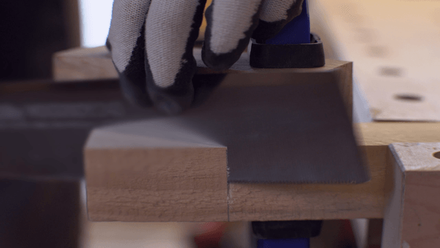 Wood being cut with a saw in a workshop