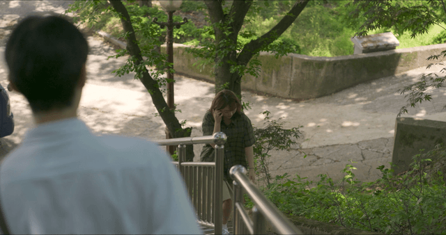 Man running away after seeing woman climbing stairs