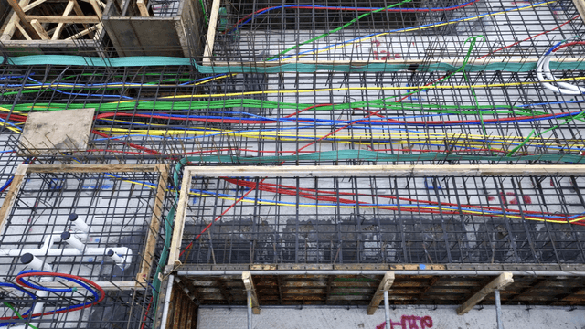 Colorful cables and rebar at a construction site