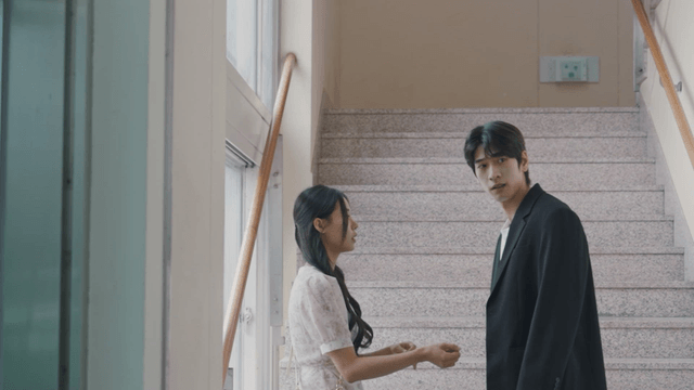 Man dragging a woman up the stairs