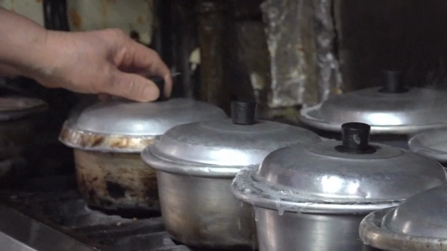Steaming pots on a stove in a kitchen