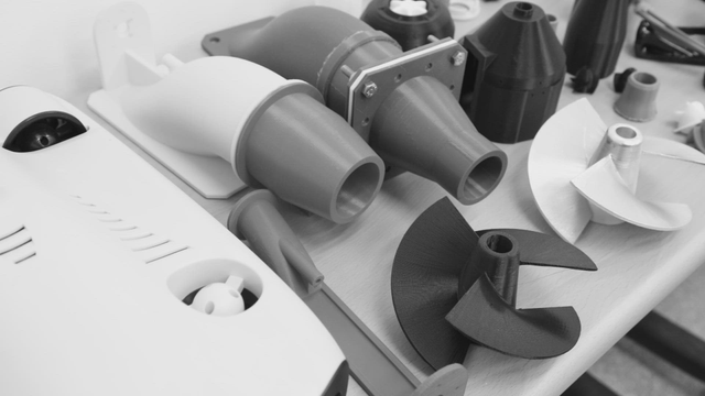 Various 3D printed parts on a table