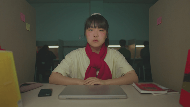 Student sitting in a quiet reading room