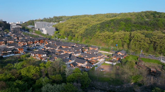 Traditional hanok village surrounded by mountains