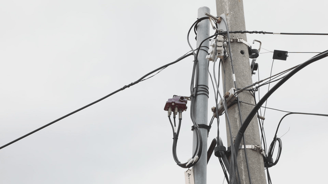 Utility pole with wires and equipment