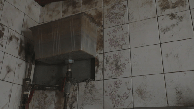 Old bathroom with stained tiles