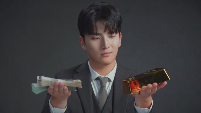 Man in a suit weighing money and gold