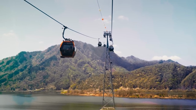 Cable cars over a scenic mountain lake