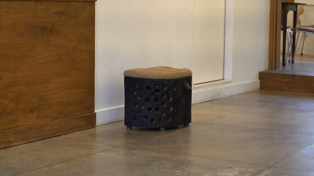 Small and unique wooden chair in a cozy interior space