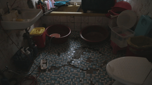 Cluttered bathroom with various items